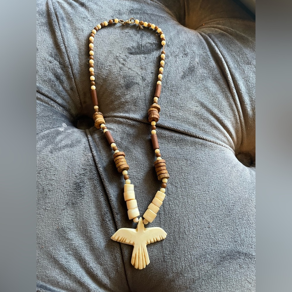Beautiful hand carved bird necklace.